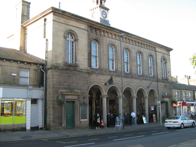 large stone building with clock in glossop